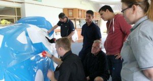 Students get hands-on experience at Spicers' vehicle wrap training day, wrapping up two cars with a glossy overlaminate